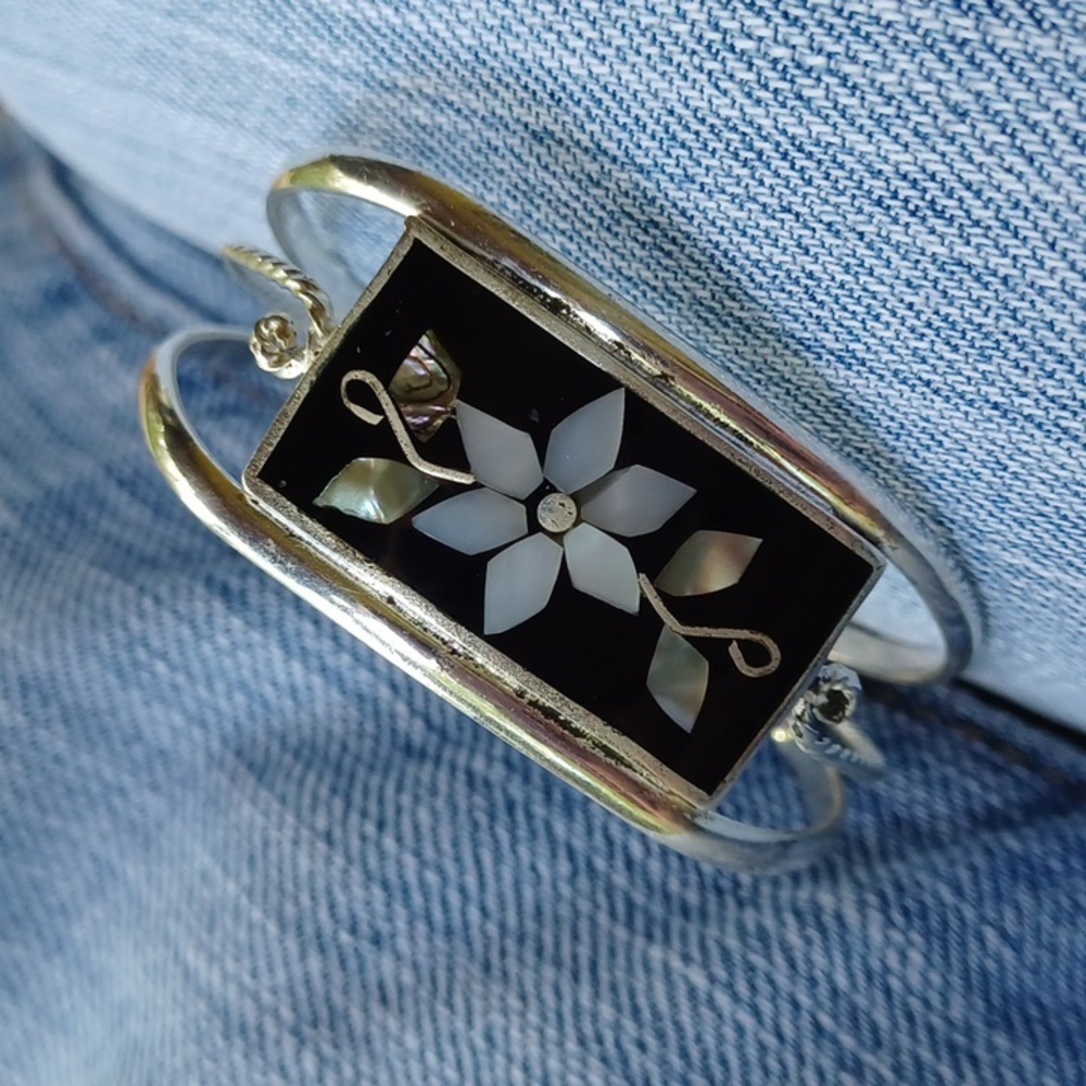 Inlaid cuff.